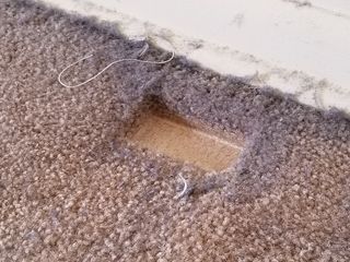 Imprint in the carpet where the bed sat for ten years.  It was compressed so thoroughly that it looked like someone had cut a section out of the rug.