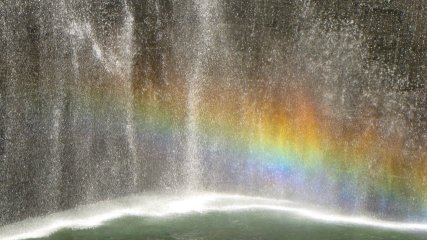 The footprints of both of the old Twin Towers were made into fountains. On this sunny day, I used the polarizing filter on my camera to bring out a rainbow in the spray from the North Tower's fountain. I thought it seemed quite fitting.