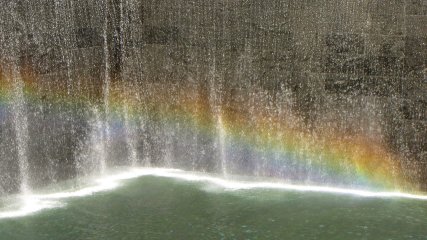 The footprints of both of the old Twin Towers were made into fountains. On this sunny day, I used the polarizing filter on my camera to bring out a rainbow in the spray from the North Tower's fountain. I thought it seemed quite fitting.