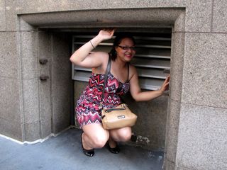 In our hunt for a subway station, Doreen found this little alcove in a building wall, and posed with it. The first pose was with a smile, and then the second one was sort of a "trapped" pose.