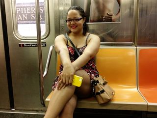 Doreen rides on car 2253. The Christopher Street-Sheridan Square station is visible in the background.