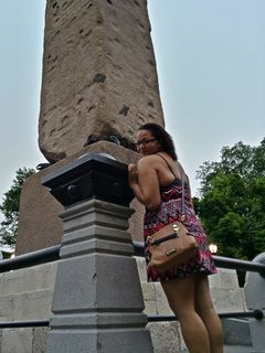 Doreen poses for a photo with the obelisk.