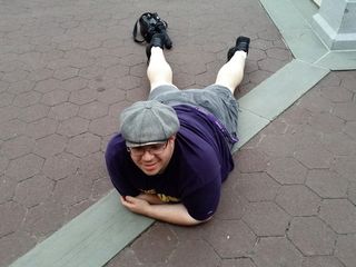 Laying on the ground in front of Cleopatra's Needle.