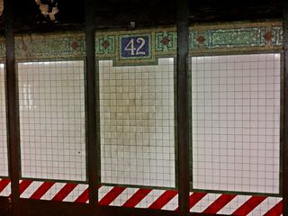 Tilework on the trackside wall at 42nd/Times Square.