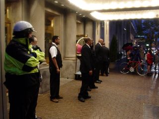 Meanwhile, hotel staff and the police guarded the hotel doors, to keep the demonstrators out of the building.