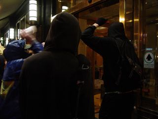 When some members of our group realized that we'd caught the hotel off guard, part of our black bloc marched directly into the hotel's lobby.
