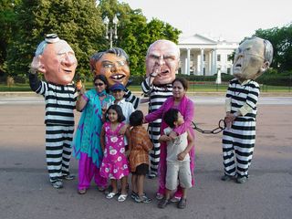 A number of people also took a moment to pose for photos with the people portraying Bush, Cheney, Rumsfeld, and Condoleezza Rice.