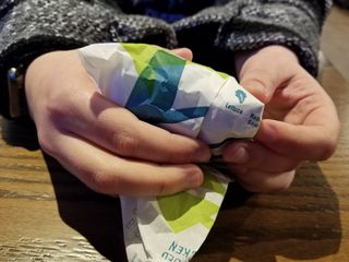 Elyse holds the wrapper for a taco at a Taco Bell in Alexandria, Virginia while we were eating out after a union meeting.