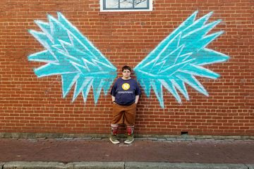 Later on, we went to downtown Frederick, where we posed with some wings that had been painted in chalk on a building wall for the "Fire in Ice" festival that had recently been held.
