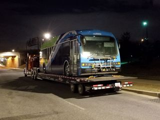While we were out, we spotted one of Ride On's new all-electric Proterra buses' being delivered to their Gaithersburg facility, which is across the street from the UPS locker.
