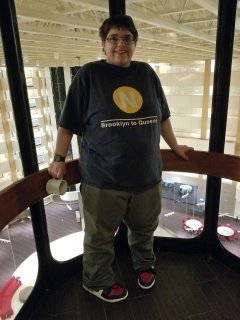 Elyse smiles while in the elevator of the Hilton in Rockville on February 26.  This hotel had a very large atrium, and two banks of glass elevators.