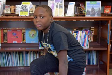 While we were at the library, we met this child, who had made friends with Elyse by the time that I arrived at the library.  He saw my camera and asked for me to take his photo.