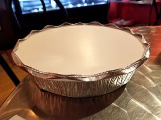 When it was time for us to go, I was particularly proud of how perfectly I had set the cover on the pie plate.  Elyse, however, didn't find it as perfect as I did, and flattened my beautifully crimped edge.