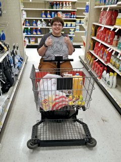 Elyse, meanwhile, smiles for the camera in the cleaning aisle.