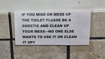 I spotted this sign in the restroom at the Harley dealership.  I love this sign, because it's so true, especially with boys, and it is so polite and yet quite blunt at the same time.  And the message is so simple: if you miss, clean up your own overspray.