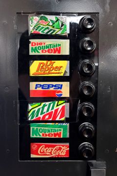 I loved looking at the labels on this vending machine, because based on those logos, you can tell that it's been around since at least the nineties, with a couple of extra Mountain Dew slots added in the 2010s.