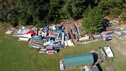 The grounds of Reese Sign Services contained the signs for many well-known brands, including McDonald's, Michaels, Sherwin-Williams, Quality Inn, and a whole host of other national and regional companies.