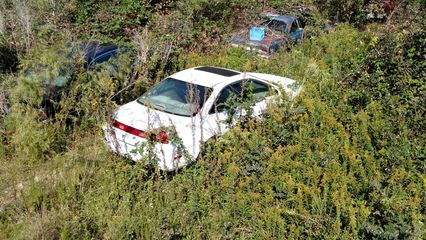 A white Honda Accord coupe.