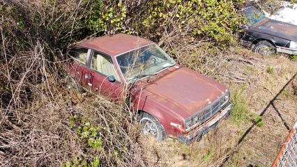 A maroon AMC Spirit.