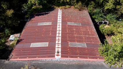 Roof of a building on the Collier Motors lot.