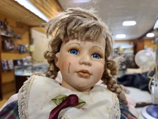 I found this doll on one of the tables, and couldn't help but to comment, "This doll looks like she's been through a few fights in her life."