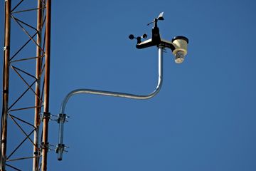 On the guyed antenna that prevented me from getting to the siren with the drone, Elyse and I spotted a small weather station, used to measure the speed and direction of the wind.