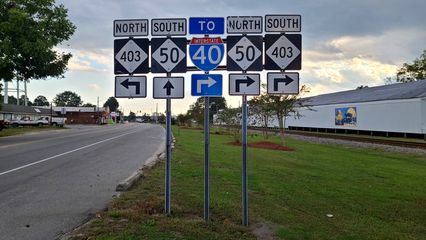 Signage assembly including an I-40 shield.