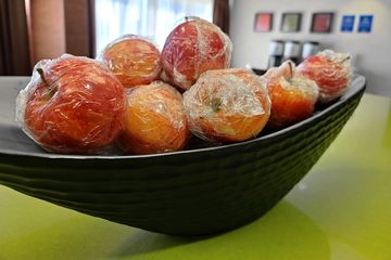 This fruit in the breakfast room, wrapped in cling wrap, was one of only a very few pandemic-related safety theater measures being taken by the hotel.