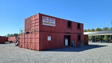 A structure on the property built out of shipping containers, presumably used for training purposes.