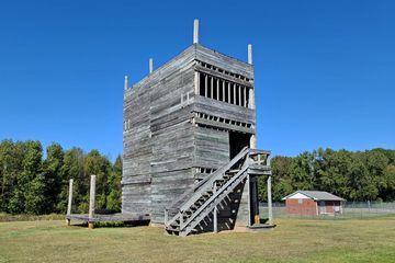 A wooden structure on the property, also presumably used for training.