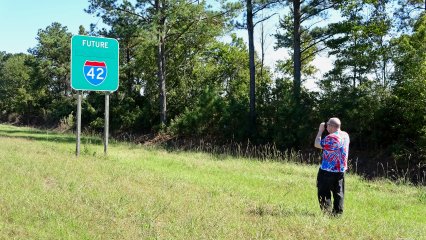 Elyse also got a photo of me geeking out at the sign.