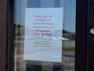 Sign in the window at Chick-fil-A, asking that people be polite to the employees in the restaurant.