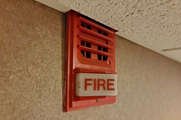 Fire alarm horn/strobe at the Bridgepointe.  It was mounted just a little higher than the drop ceiling, and so a hole was cut to accommodate it.