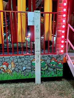 Height limit sign on a children's funhouse attraction, specifying the allowable height range.  Adults were prohibited, as were kids that weren't tall enough.