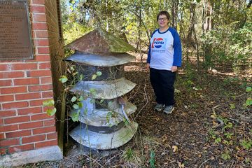 Elyse poses for a photo with the siren.