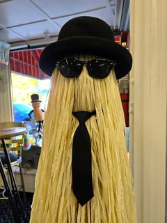 A statue of Cousin Itt from The Addams Family at Fork in the Road.