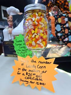 A contest where you guess the amount of candy corn in the mason jar for a chance to win a gift certificate.