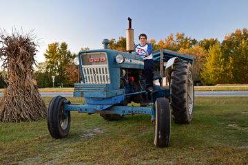 Elyse poses for some photos with the tractor.