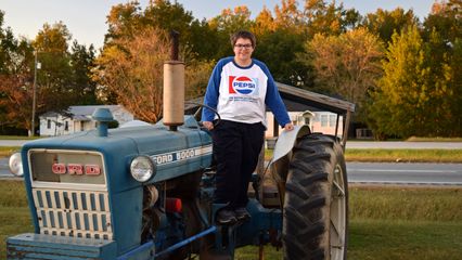 Elyse poses for some photos with the tractor.