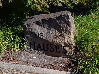 Stone in front of the building reading "The Hauses".  I found this surprising, because that stone didn't seem like it would be at a commercial building.  It would look right at home in front of a private residence, but not a commercial setting.