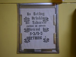 I loved these sorts of signs because they are authentic from the period that the ship was last in active service.  It's clear that they were created on an old print program and printed on a dot matrix printer in the early 1990s, and look every minute of it.
