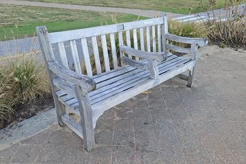 This bench bothered me because a center armrest had been added as a retrofit, presumably to keep the homeless from sleeping on them - a textbook example of hostile design.