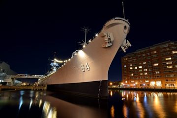 The USS Wisconsin at night.