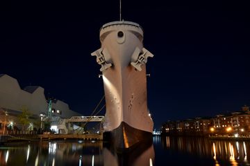 The USS Wisconsin at night.