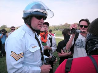 A Park Police officer explains the regulations regarding demonstrations around the Washington Monument. To his credit, this particular officer, C.R. Holmberg, was extremely polite and professional with us - nothing less than a gentleman.