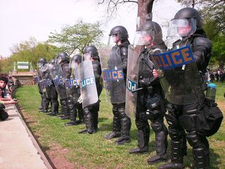 Capitol Police officers in full riot gear fortified the retaining wall, in order to maintain separation between the Nazis and us.