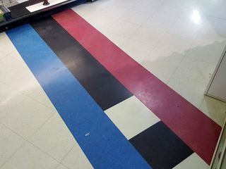 The border, marked along the floor, with the blue side in North Carolina, and the red side in Virginia.