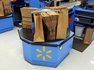 Unike most stores, the bagging wheels at this Walmart store are outfitted for paper bags instead of plastic.  This is due to a ban on plastic bags that was enacted in 2009 for the Outer Banks, affecting Bodie, Hatteras, and Ocracoke Islands, i.e. from Corolla all the way down to Ocracoke.