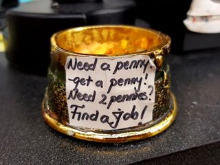 Penny jar at Super Wings, which I spotted while we were buying that dolphin plush for Elyse.  I found that "Find a job!" part to be a bit obnoxious.  Clearly, people don't think before they put notes like this on public display.  It reminded me of that similarly obnoxious box sign from Virginia Beach.