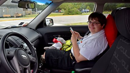 Elyse, in the car.